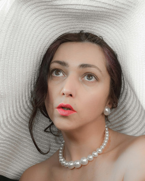 Woman wearing a pearl choker