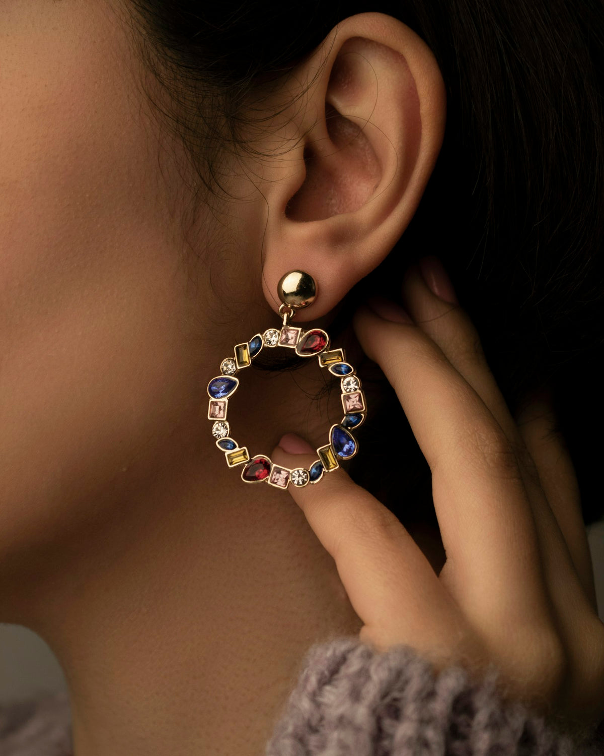 Link hoop earring worn on the ear