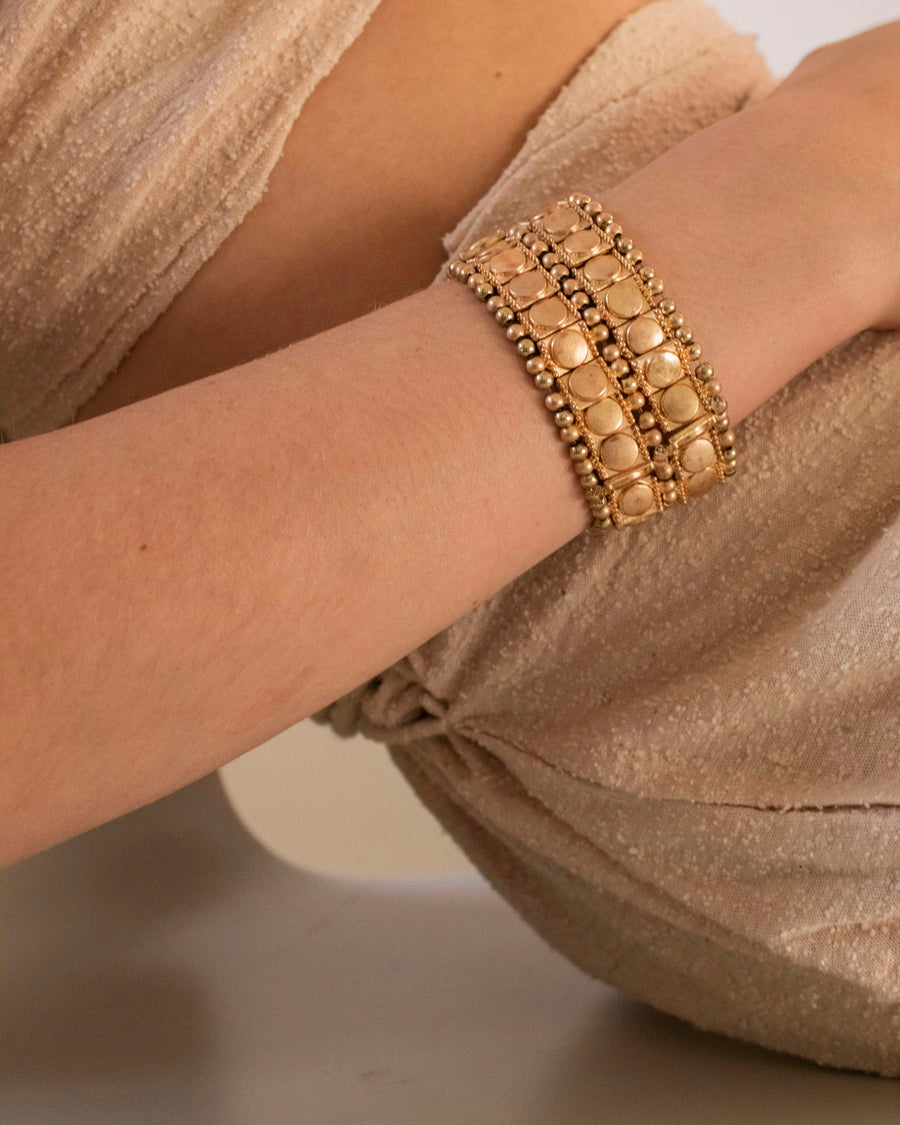 Gold tennis bracelet on the wrist