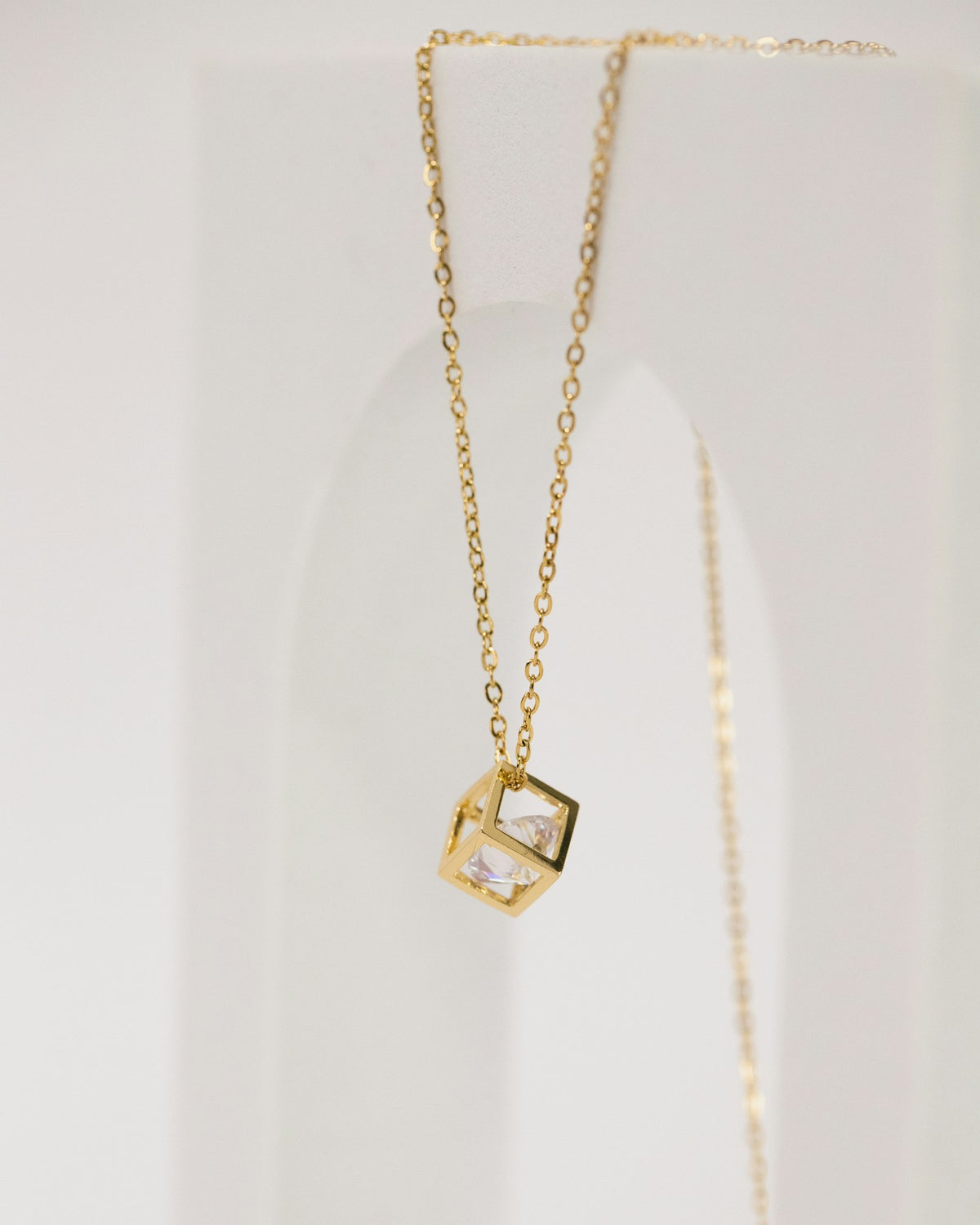 Gold necklace with a square pendant