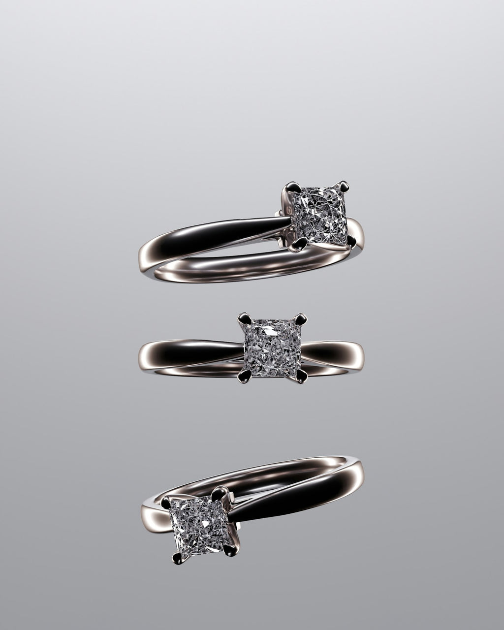 Three diamond rings set on a table