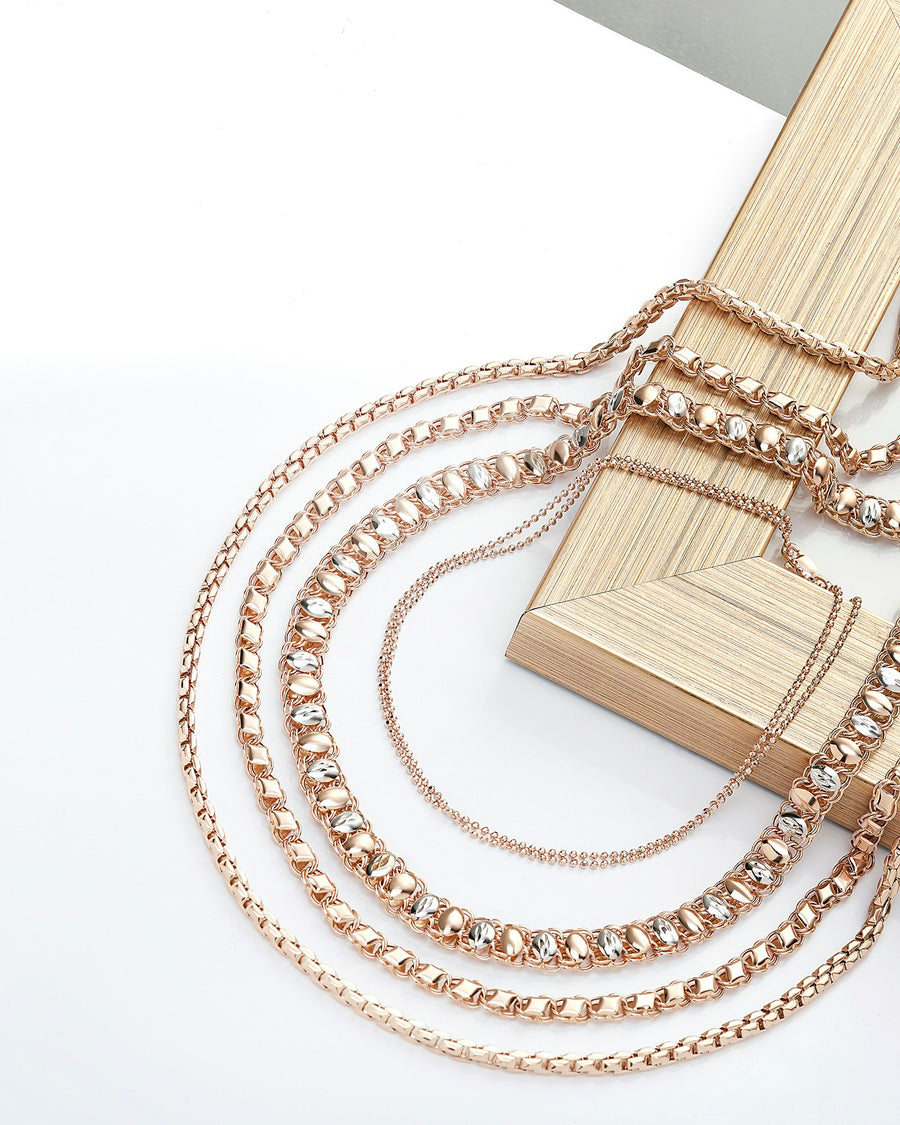 Fine chain bracelets arranged together