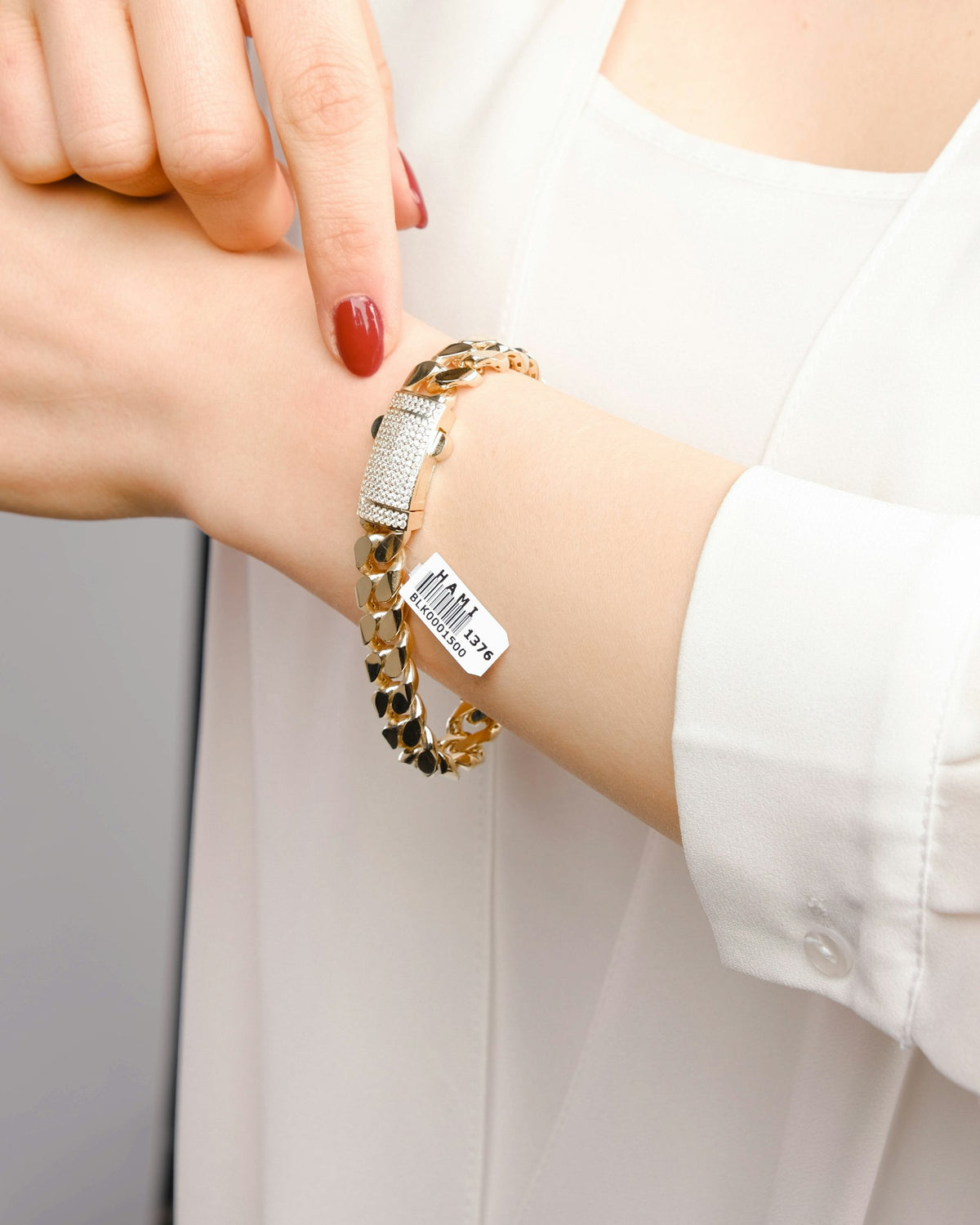 Bracelet with a tag charm worn on the wrist