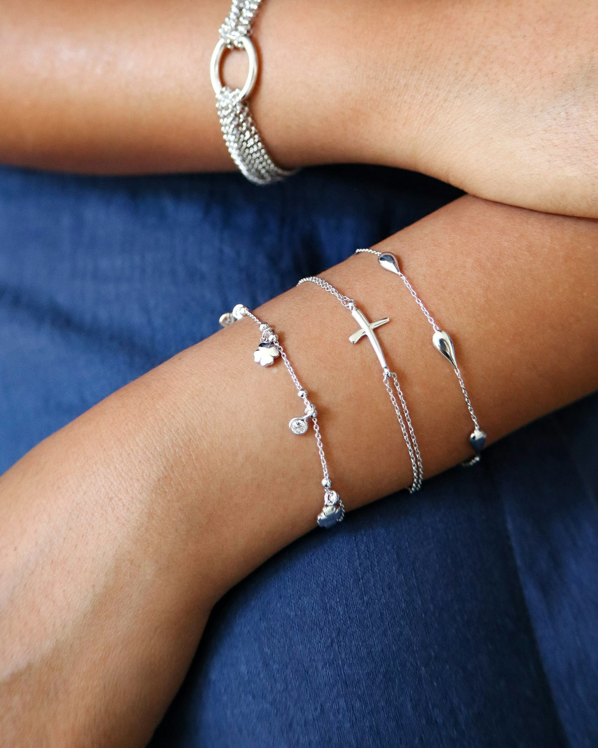 Delicate bracelets worn on both wrists