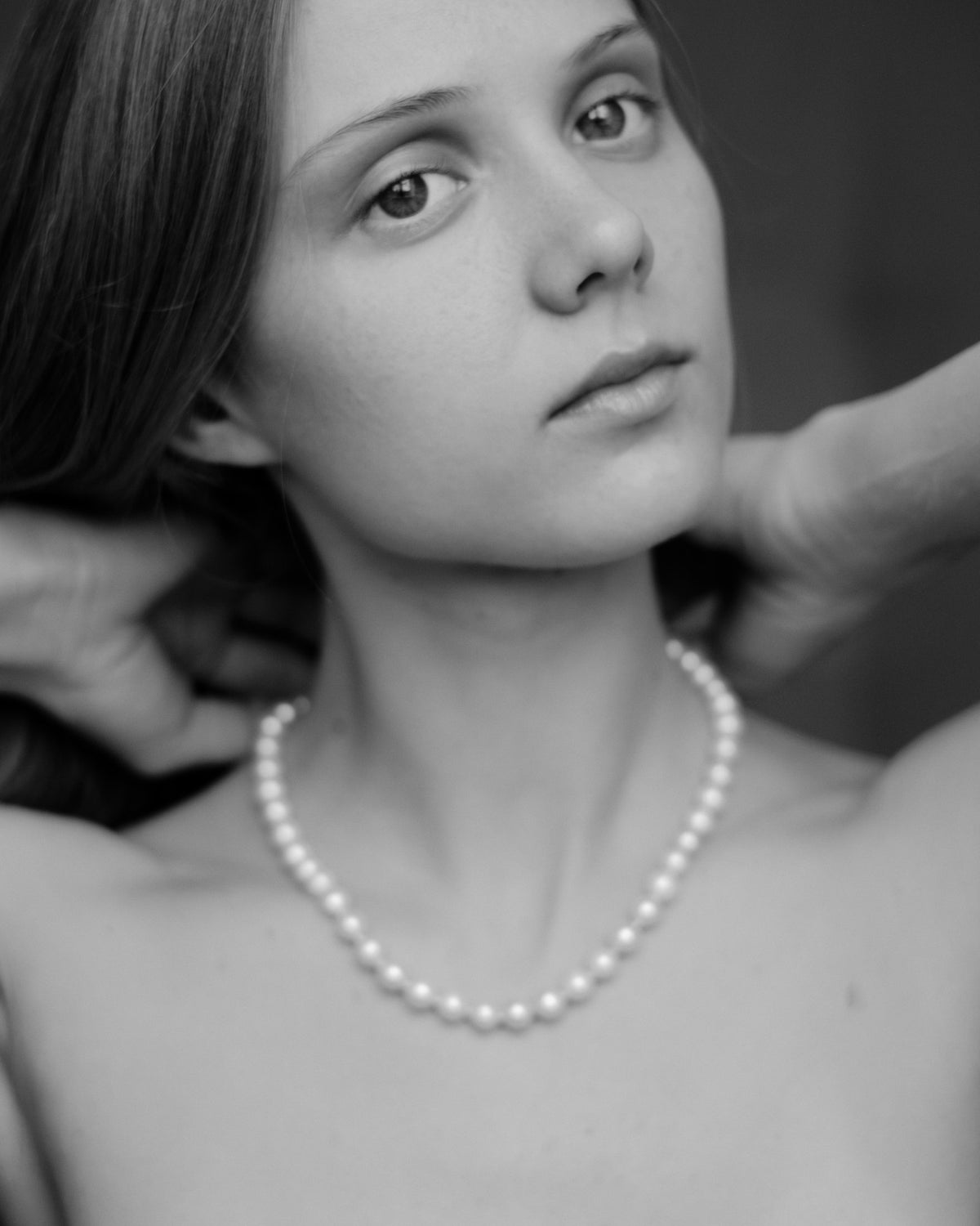Woman wearing a pearl necklace