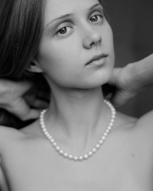 Woman wearing a pearl necklace