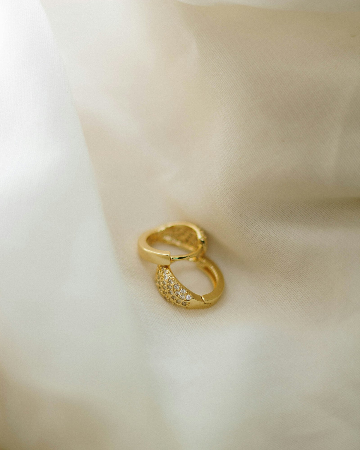 Earrings with small diamonds on satin