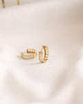 Gold hoop earrings set with baguette stones