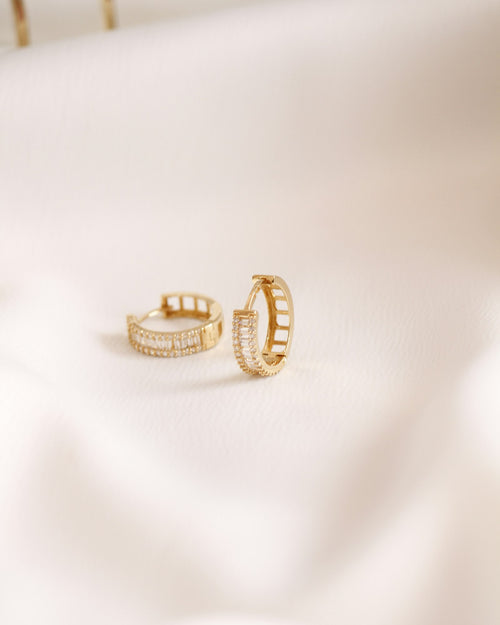Gold hoop earrings set with baguette stones